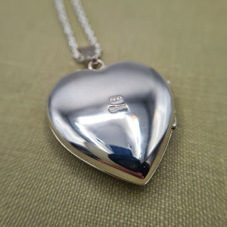 reverse of heart locket with full UK hallmark