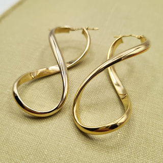 large women's gold figure 8 creole earrings