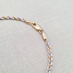 lobster clasp on women's gold bracelet
