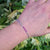 slim tennis bracelet on wrist