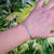 another view of slim silver tennis bracelet on ladies wrist