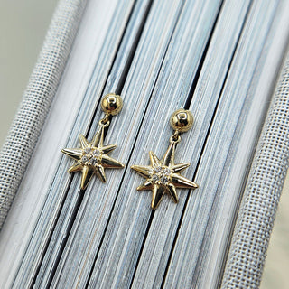 gold stud earrings with star drop charms