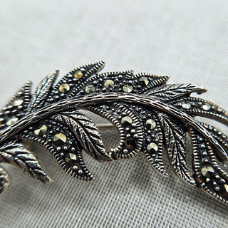 close up of marcasite stones in brooch