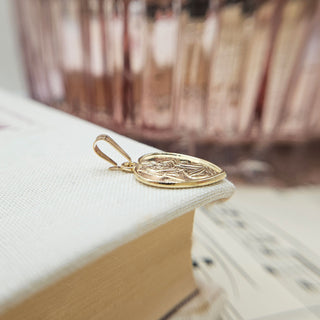 dainty heart pendant with st christopher emblem