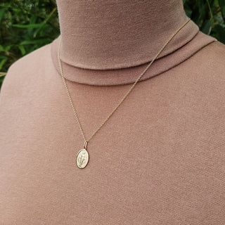 gold miraculous necklace