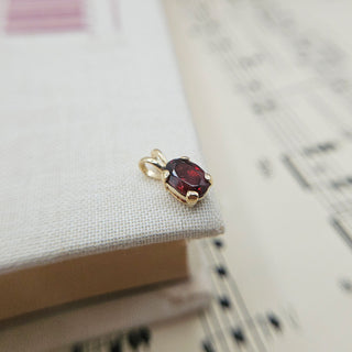 9K gold garnet charm