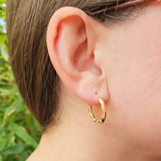 engraved and polished gold hoops