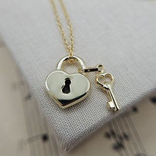 gold padlock and key pendant