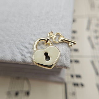 gold padlock and key pendant