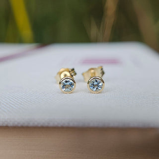 dainty aquamarine stud earrings in 9ct gold