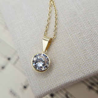 round cz charm necklace in gold