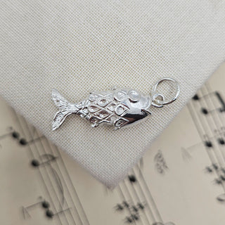 read silver fish charm with British hallmark