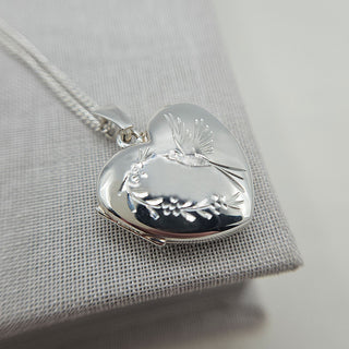 silver heart photo locket with hummingbird design