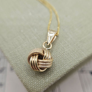 gold textured knot pendant and chain