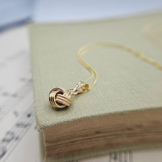 dainty gold knot necklace in 9K gold