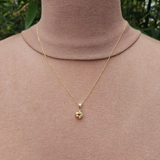 yellow gold knot pendant necklace