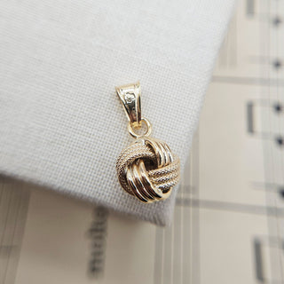 yellow gold knot pendant