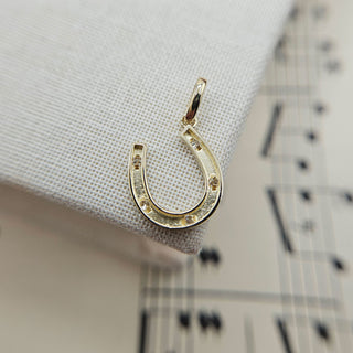 reverse side of horseshoe charm pendant
