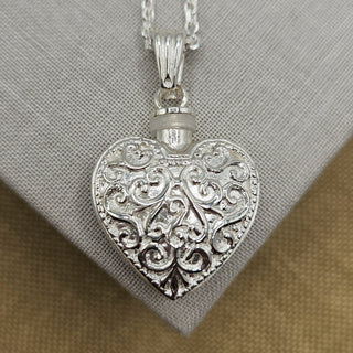 close up of embossed design on heart shaped locket