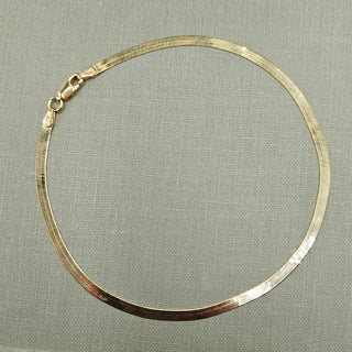 flat snake chain ankle bracelet in yellow gold
