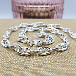 close up of sterling silver anchor links on chain