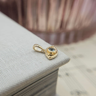 side profile of evil eye charm pendant