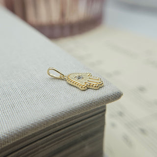 side profile of beaded hamsa hand charm