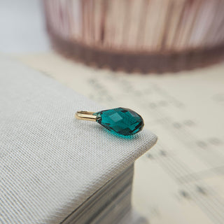 beautiful faceted details on green crystal pendant