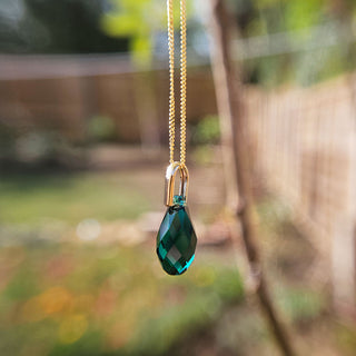 green crystal teardrop pendant with 9ct gold bail