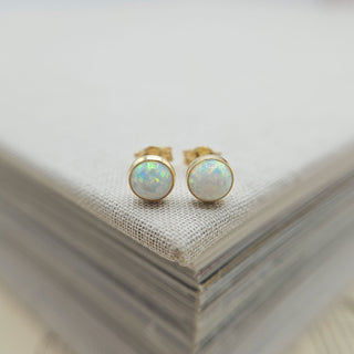 dainty opal stud earrings in gold