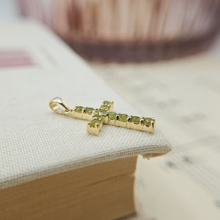 real gold cross with peridot stones
