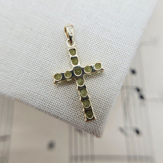 underside of peridot gold cross pendant with hallmark