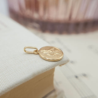 side profile of solid gold st christopher charm
