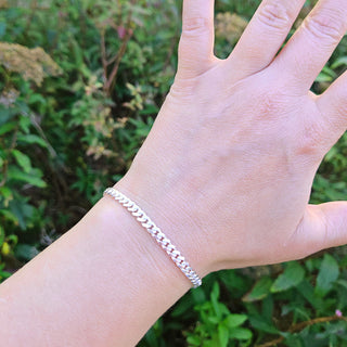 silver cuban curb bracelet on ladies wrist