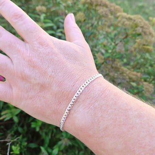 cuban curb bracelet on men's wrist