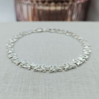 close up of byzantine links on chain bracelet