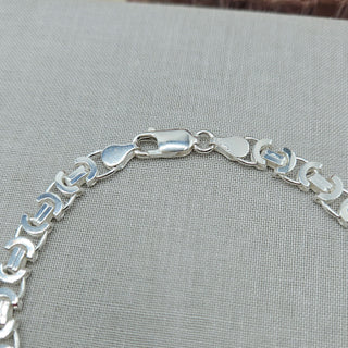 lobster clasp on silver bracelet