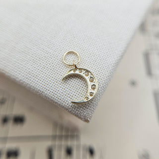 reverse side of solid gold moon charm
