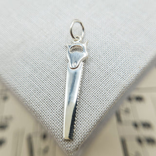 sterling silver carpenter's saw charm