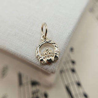 dainty claddagh charm in 9ct gold