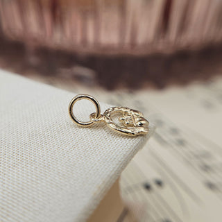 very small claddagh pendant in 9K