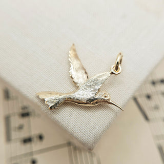 hand finished detailing to hummingbird pendant