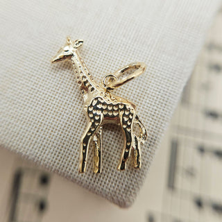 close up view of made in UK hallmarked giraffe charm