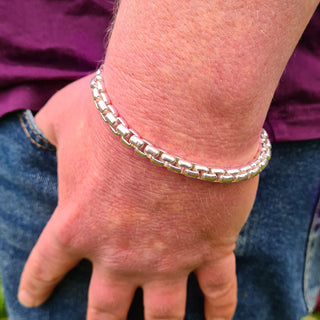 box chain bracelet on man's wrist