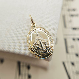 gold miraculous pendant