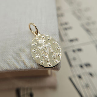 solid gold Miraculous faith pendant