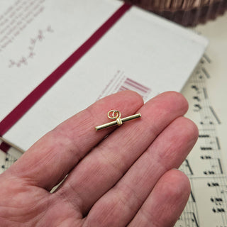 antique style t-bar pendant in hand for scale