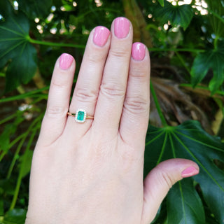 emerald diamond engagement ring ring on hand