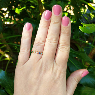 gold half eternity ring on hand