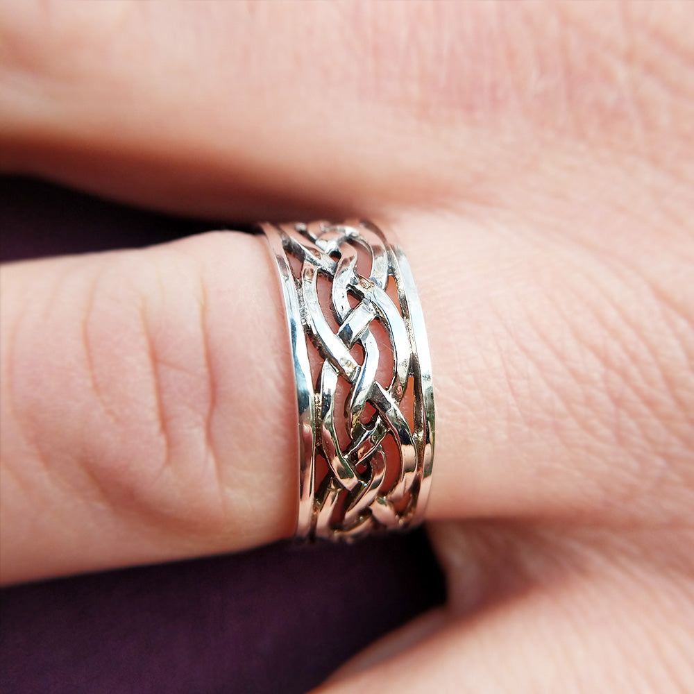 silver celtic ring on man's finger